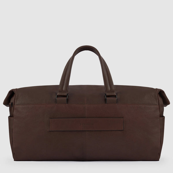 Duffel bag with trolley strap