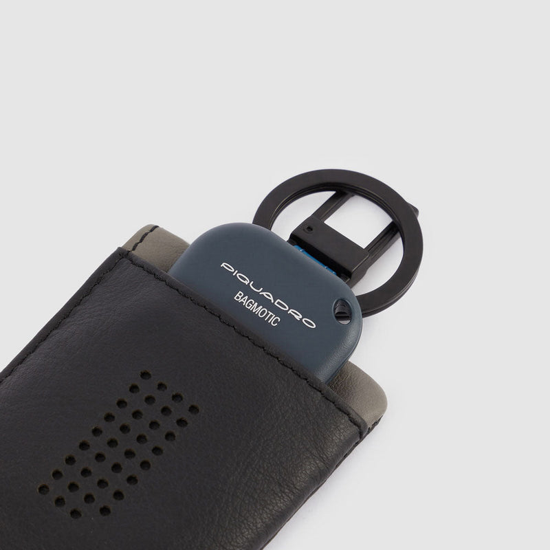 Keychain with CONNEQU and side zipped pocket