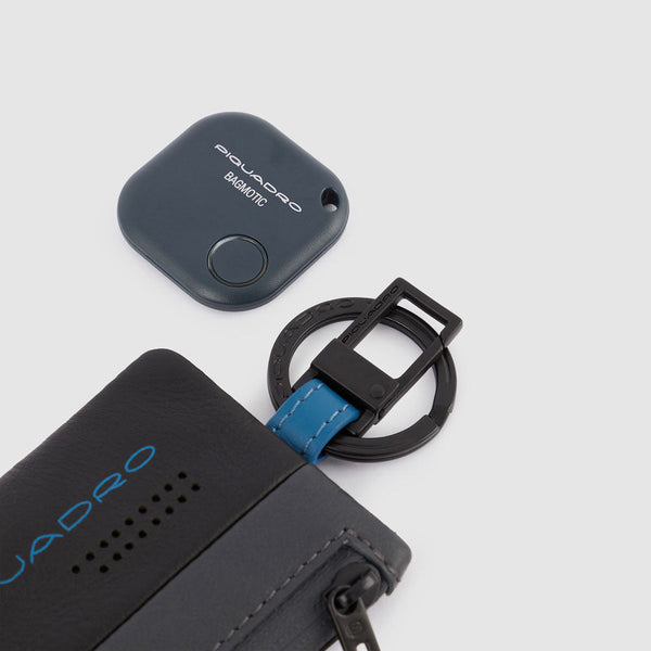 Keychain with CONNEQU and side zipped pocket