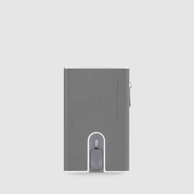 Compact wallet with sliding system and coin pocket