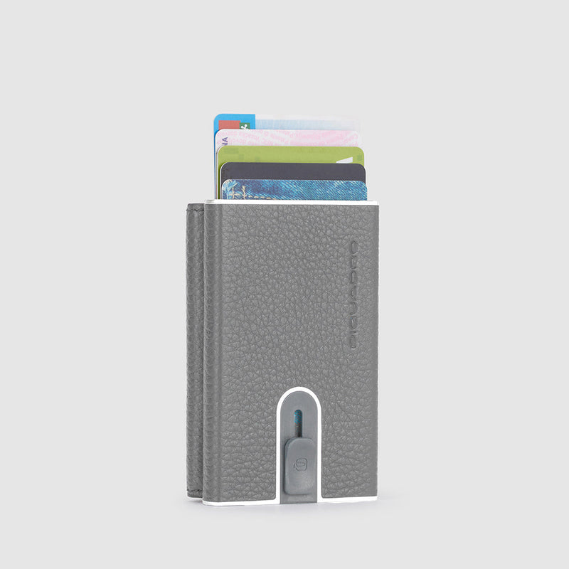 Compact wallet with sliding system and coin pocket